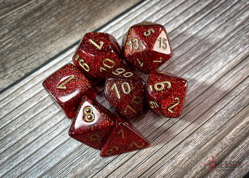 CHX27504 - Chessex: Glitter Ruby/gold Polyhedral 7-Dice Set