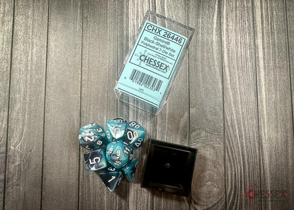 CHX26446 - Chessex: Gemini Black-Shell/white Polyhedral 7-Dice Set