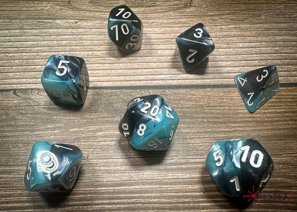 CHX26446 - Chessex: Gemini Black-Shell/white Polyhedral 7-Dice Set