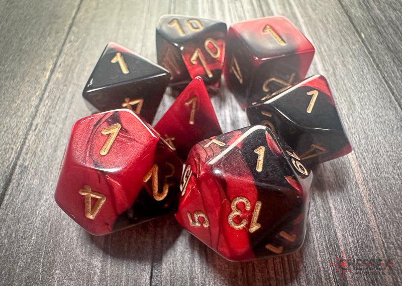 CHX26433 - Chessex: Gemini Black-Red/gold Polyhedral 7-Dice Set