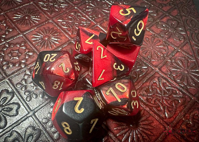 CHX26433 - Chessex: Gemini Black-Red/gold Polyhedral 7-Dice Set