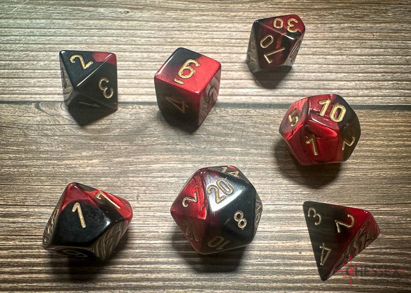 CHX26433 - Chessex: Gemini Black-Red/gold Polyhedral 7-Dice Set