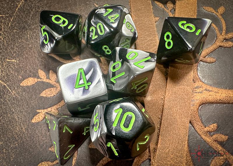 CHX26445 - Chessex: Gemini Black-Grey/green Polyhedral 7-Dice Set