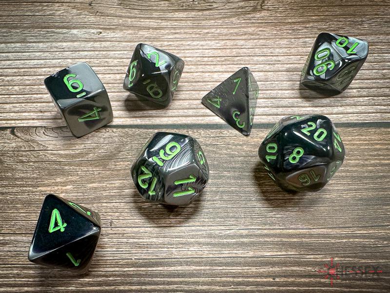 CHX26445 - Chessex: Gemini Black-Grey/green Polyhedral 7-Dice Set