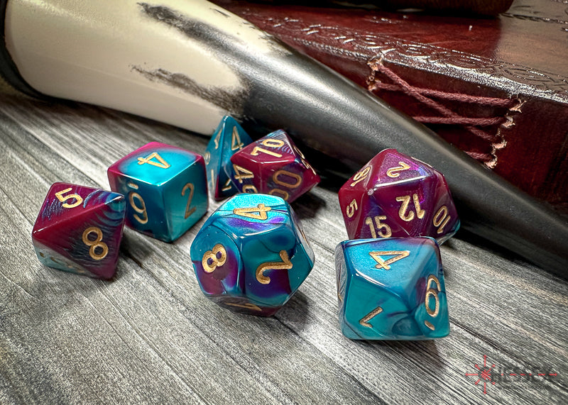 CHX26449 - Chessex: Gemini Purple-Teal/gold Polyhedral 7-Dice Set