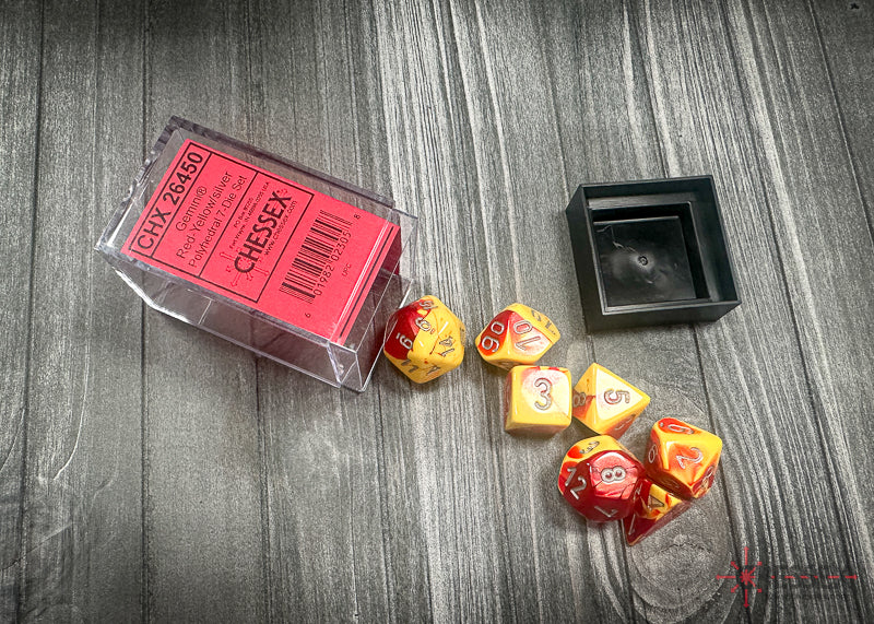 CHX26450 - Chessex: Gemini Red-Yellow/silver Polyhedral 7-Dice Set