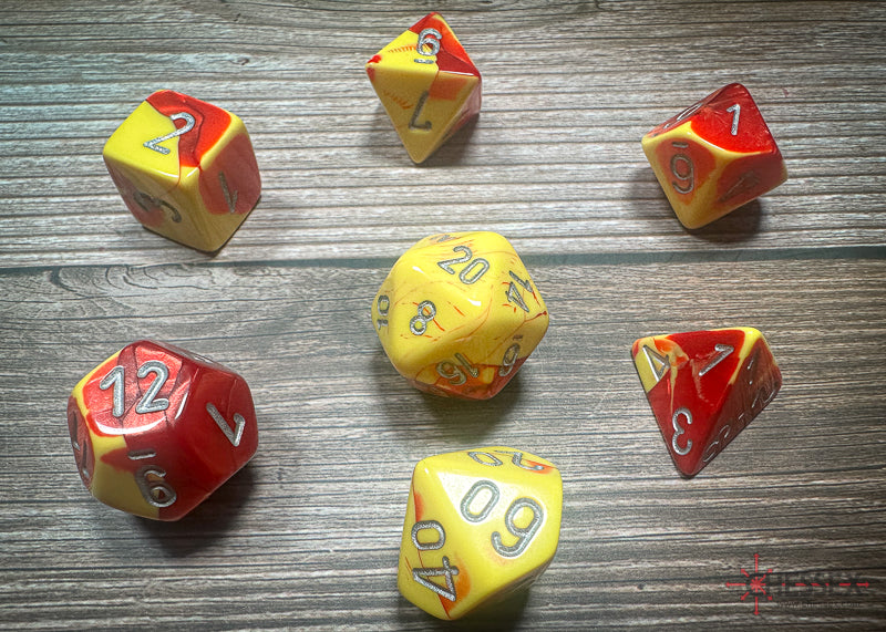 CHX26450 - Chessex: Gemini Red-Yellow/silver Polyhedral 7-Dice Set