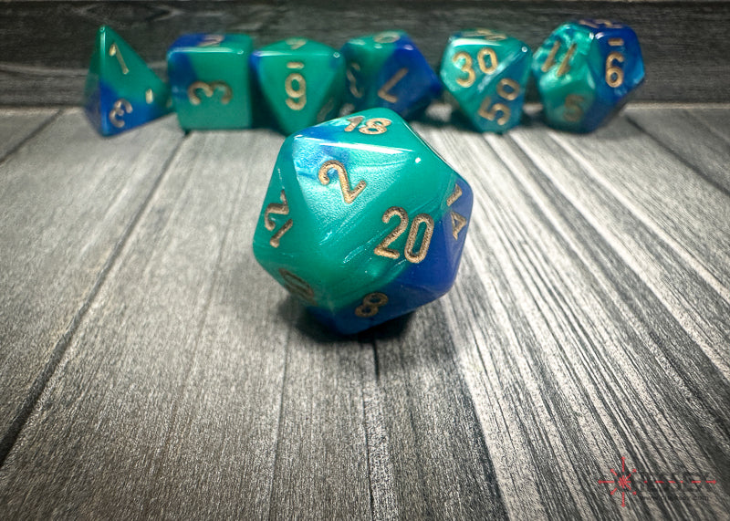 CHX26459 - Chessex: Gemini Blue-Teal/gold Polyhedral 7-Dice Set