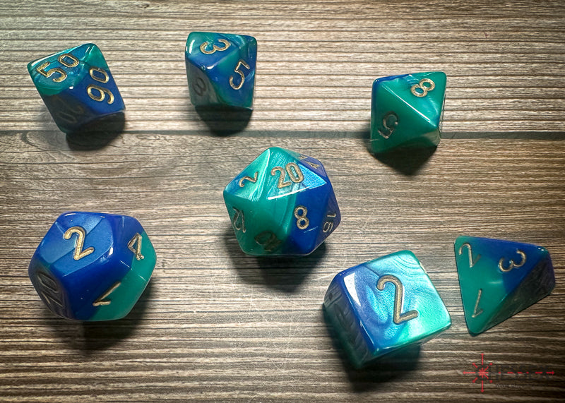 CHX26459 - Chessex: Gemini Blue-Teal/gold Polyhedral 7-Dice Set