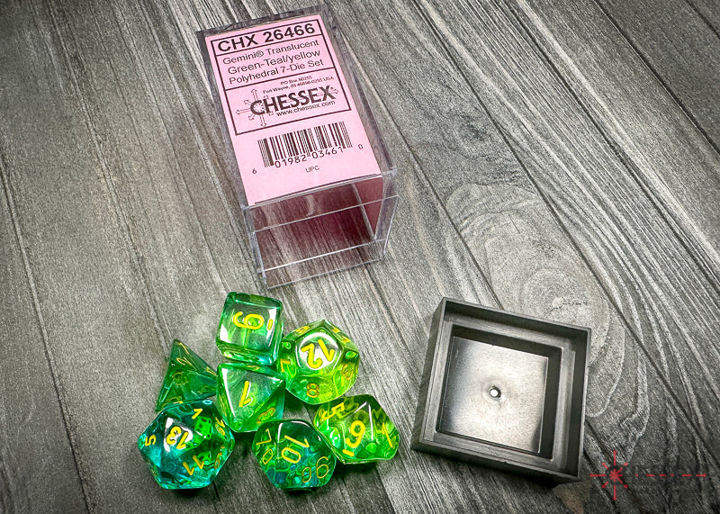 CHX26466 - Chessex: Gemini Translucent Green-Teal/yellow Polyhedral 7-Dice Set