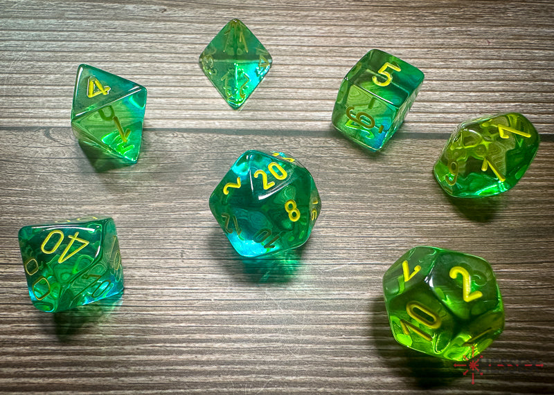 CHX26466 - Chessex: Gemini Translucent Green-Teal/yellow Polyhedral 7-Dice Set