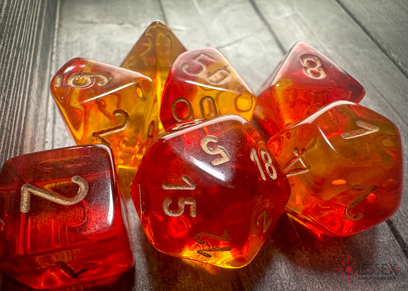 CHX26468 - Chessex: Gemini Translucent Red-Yellow/gold Polyhedral 7-Dice Set