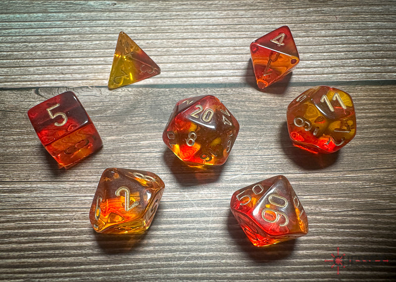 CHX26468 - Chessex: Gemini Translucent Red-Yellow/gold Polyhedral 7-Dice Set