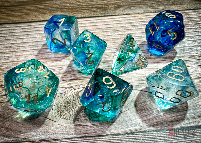 CHX27556 - Chessex: Nebula Oceanic/gold Luminary Polyhedral 7-Dice Set