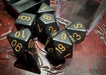 CHX25428 - Chessex: Opaque Black/gold Polyhedral 7-Dice Set